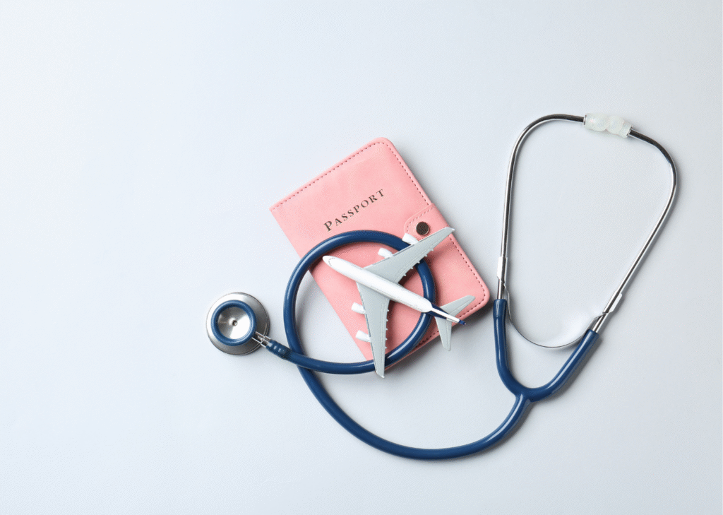 Travel and healthcare concept featuring a stethoscope, passport, and airplane model symbolizing gastric sleeve abroad.
