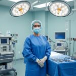 Board-certified plastic surgeon in an operating room discussing Brazilian Butt Lift (BBL) safety and expertise.