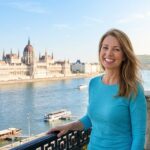 A satisfied patient with a confident smile in Budapest after getting the best dental implants.